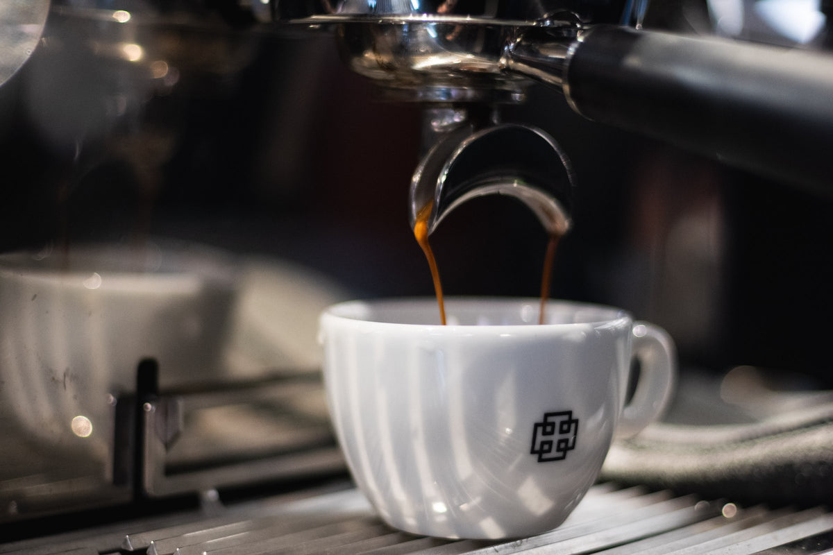 Espresso pouring into a Thomson's cup