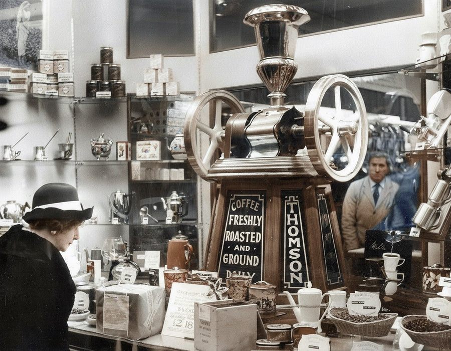 Inside an early Thomson's shop, with the coffee grinder on the counter