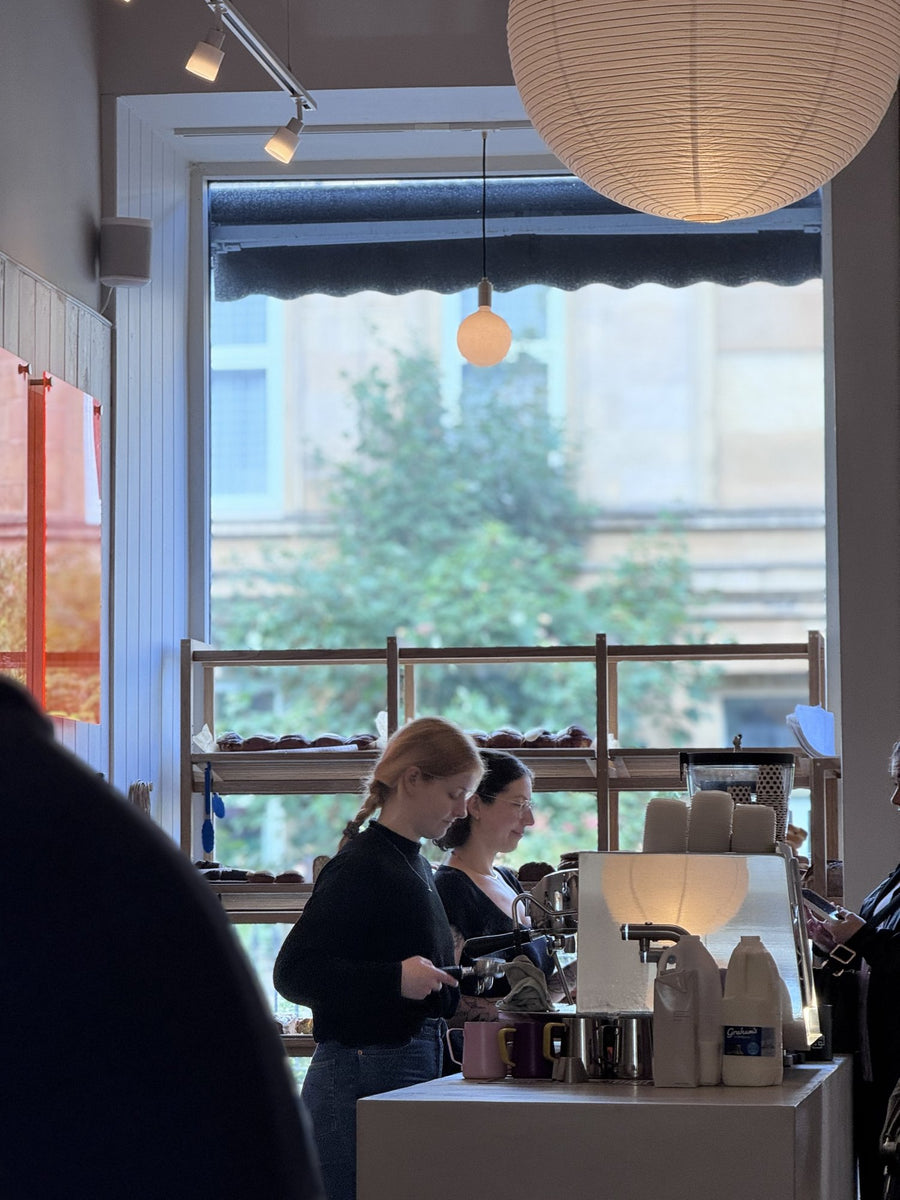 The team at the coffee machine in a bakery café serving Thomson's coffee