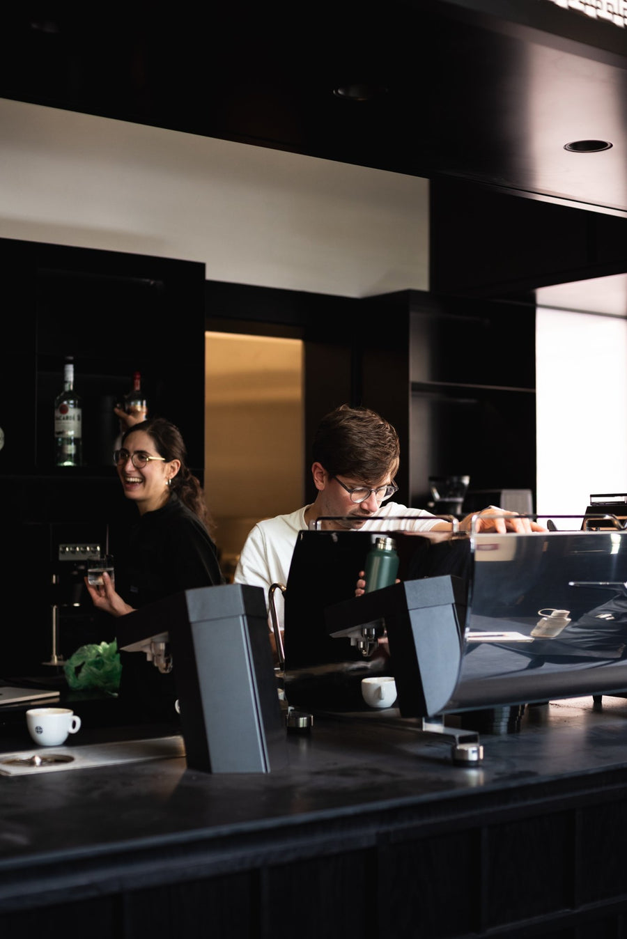 Staff behind the espresso machine at Thomson's Candleriggs